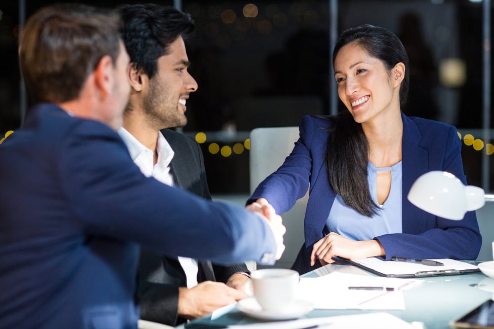 Businessman shaking hands with a colleague in the office Businessman shaking hands with a colleague in the office